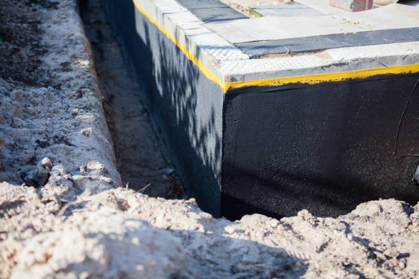 Professional Waterproofing technician working in Clare, MI
